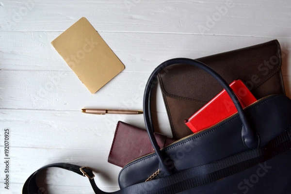 Fototapeta Business bag and empty paper on the desk. Business flat lay.
