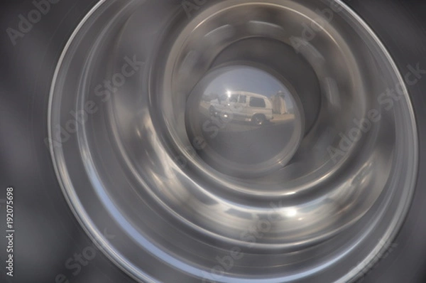 Obraz Van reflection in truck wheel