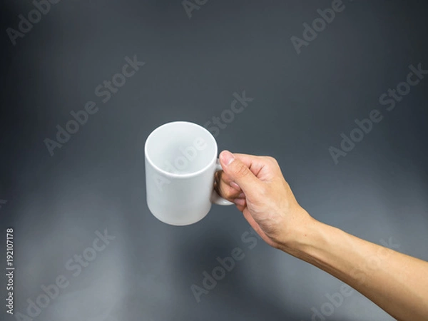 Fototapeta Empty mug with hand holding