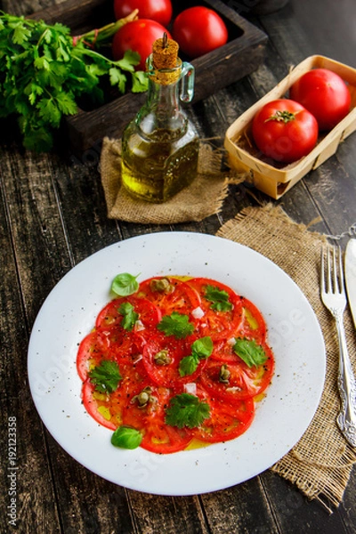 Fototapeta Carpaccio of fresh tomatoes with olive oil