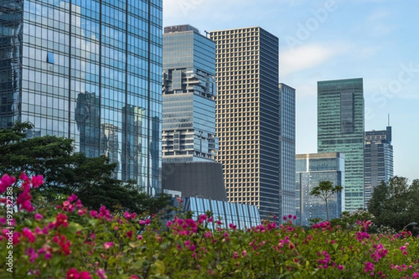 Fototapeta Modern office building against blue sky.
