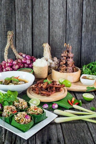 Fototapeta Spicy Raw Ant Eggs Salad, Oxtail soup, grilled ox tongue, deep fried beef on the table with herbs