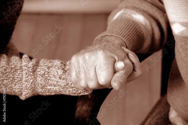 Obraz close up shot of hands holding each other