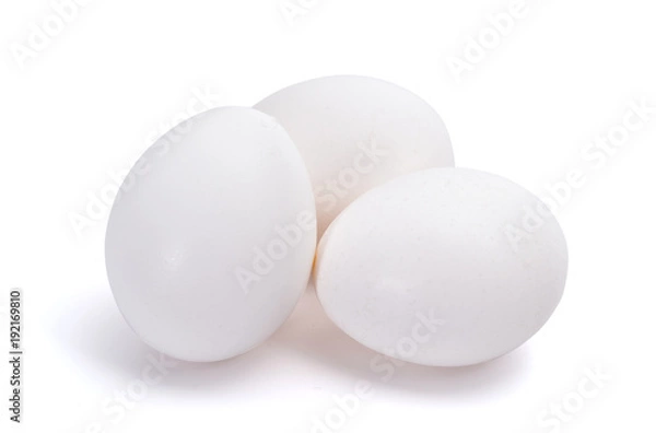 Fototapeta Group of three white eggs isolated on white background