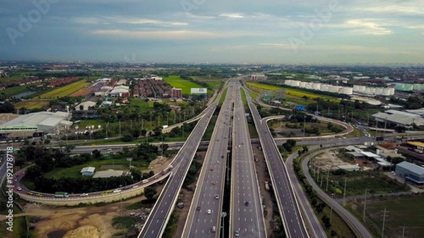 Obraz Aerial view of an intersection of a highway at the moment of sunset evening.
