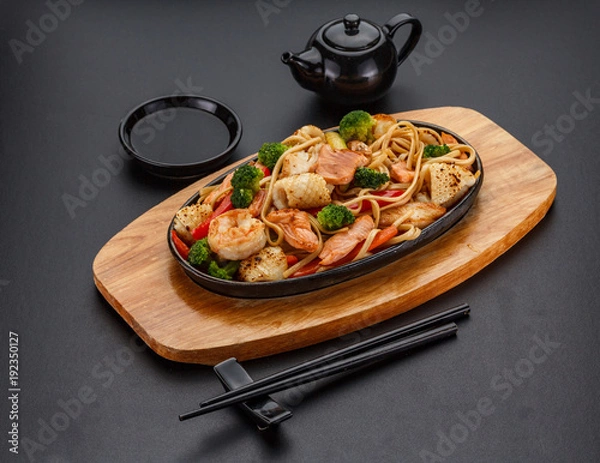 Obraz Udon noodels over dark background.