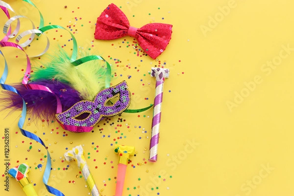 Obraz masquerade celebration concept over yellow background