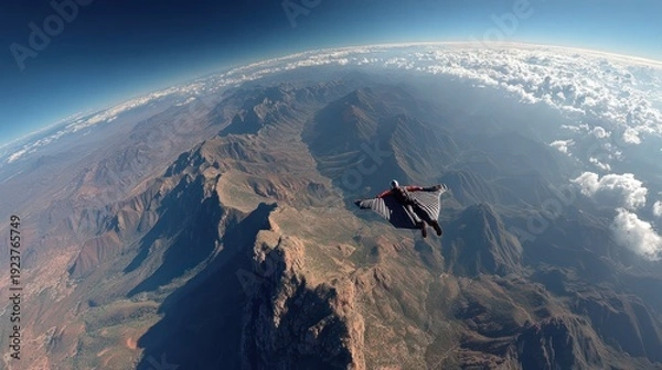 Obraz Wingsuit Flying over rock mountain