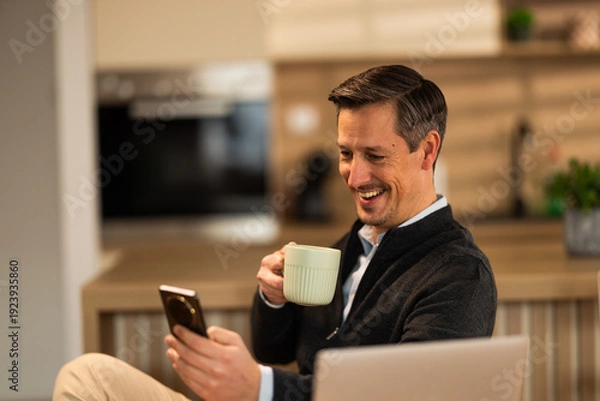 Obraz Man Checking Social While Drinking Coffee