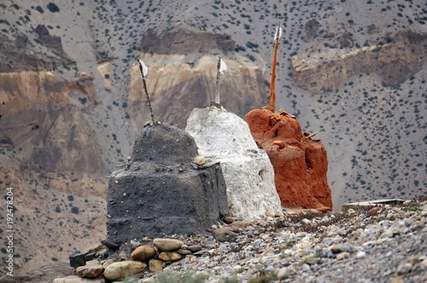 Fototapeta Buddhist Chortens for protection from evil spirits, near Kagbeni. Trekking to the Upper Mustang. Nepal.
