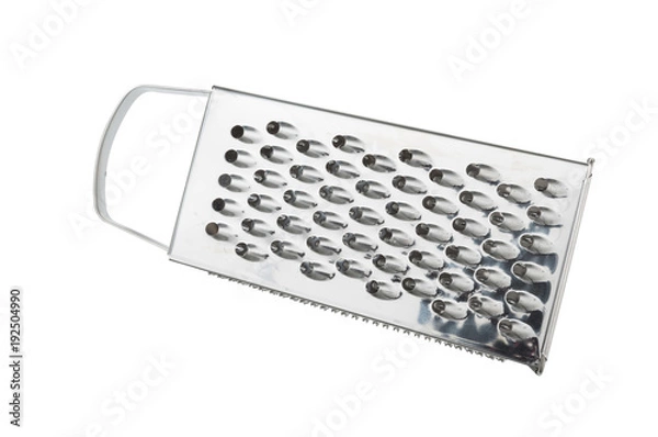 Obraz Grater for vegetables. Kitchen accessories. Tools for cooking. A spoon. Isolated on white background. For your design. An object.