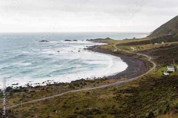 Fototapeta Landscape view of a road next to the ocean in New Zealand. 
