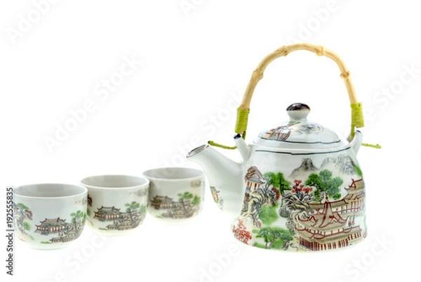 Fototapeta Teapot with cups on a white background.