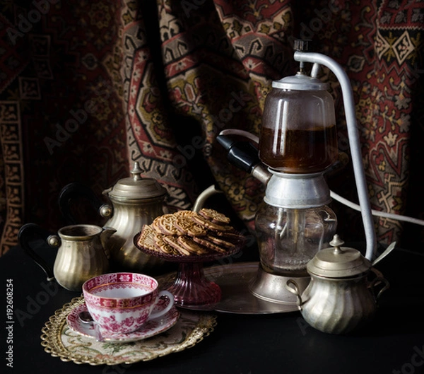 Obraz Old coffe machine before a carpet with antique interior