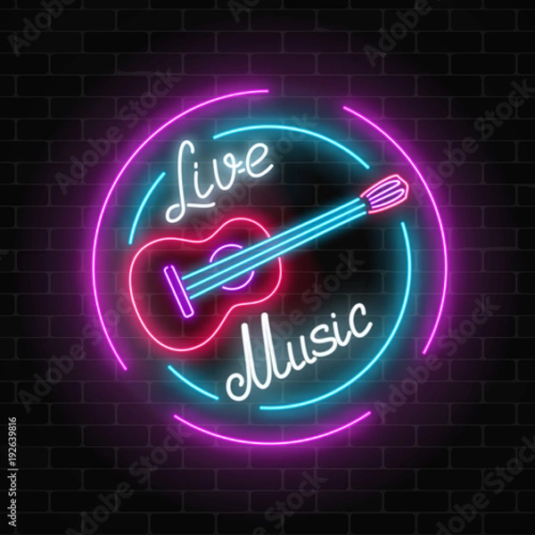 Fototapeta Neon sign of bar with live music on a brick wall background. Advertising glowing signboard with classic guitar symbol.
