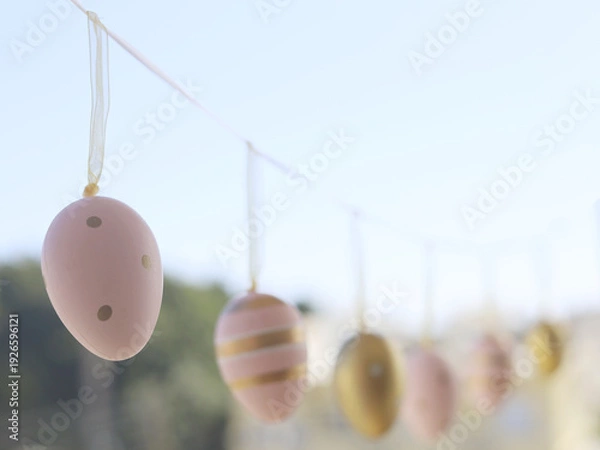 Obraz Pastel Easter Eggs Hanging Along Garden String
