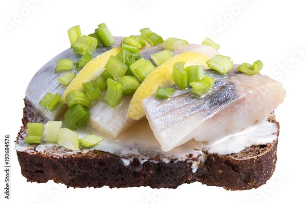 Fototapeta Herring sandwiches with onion and lemon on white background