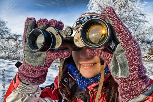 Obraz woman hiker with binoculars