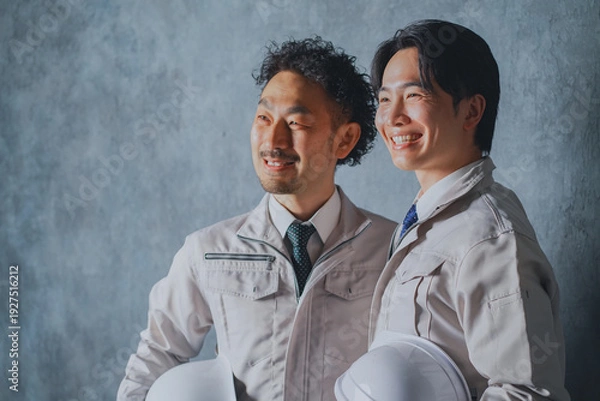 Obraz ヘルメットを持った作業着姿の男性