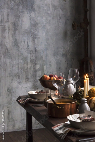 Fototapeta Rustic table setting with pumpkin soup and pumpkins