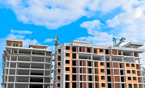 Obraz Monolithic construction site with crane and sky