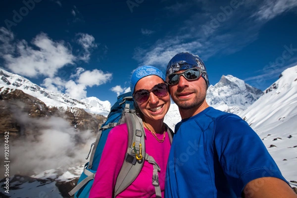 Fototapeta Couple makes selfie in the mountains on the way to Annapurna base camp