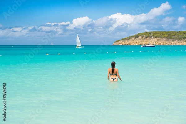 Fototapeta sensual girl in sexy bikini on sea beach in antigua