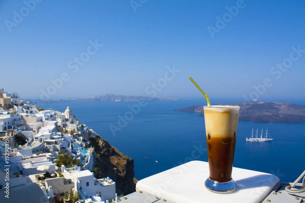 Obraz Greece Santorini island in Cyclades, coffee espresso freddo with wide sea of caldera in greek caffe