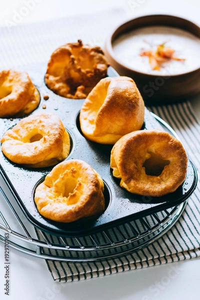 Fototapeta Yorkshire puddings with fish filling, in an old metal tray