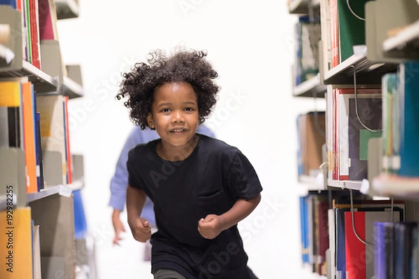 Fototapeta Happy kids lifestyle in the Library. Young people explore lifestlye in the Library. Development of Human Resources in Education Concept. Setup studio shooting.