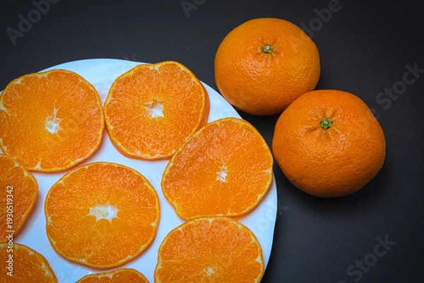 Obraz 皮が薄くてむきやすく、果汁たっぷりで本当においしい愛媛県産の柑橘類・甘平の輪切り