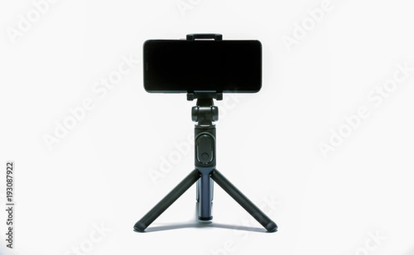 Obraz smart phone and tripod isolated on white background