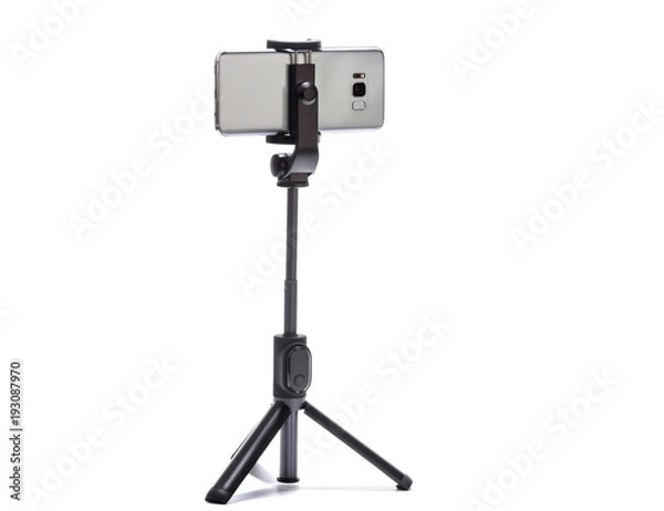 Obraz smart phone and tripod isolated on white background