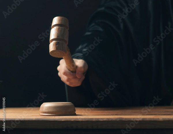 Obraz 3006919 Hand banging gavel on dark background, the judge makes a verdict,