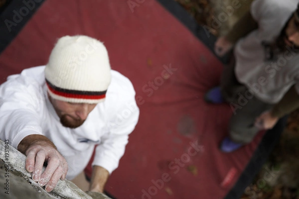 Fototapeta holding on - rock climbing series