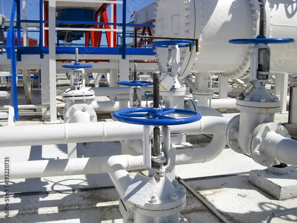 Obraz Heat exchangers in a refinery. The equipment for oil refining. Heated gasoline air cooler