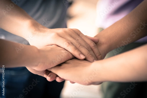 Fototapeta business has hands stacked together.