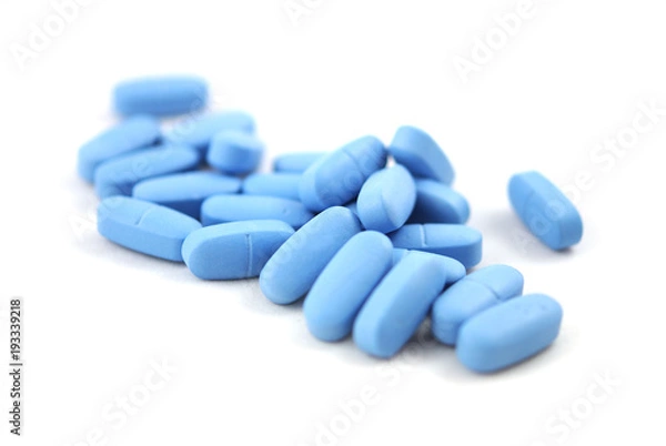 Obraz Big blue oval tablets closeup on white background