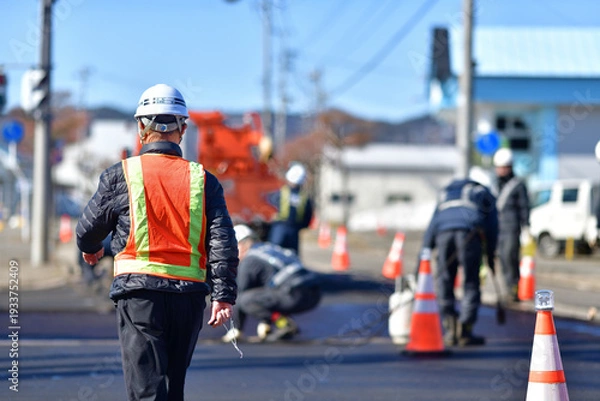 Obraz 街路舗装工事を監督する工事部長