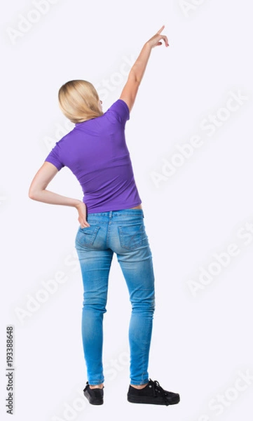 Obraz Back view of  pointing woman.