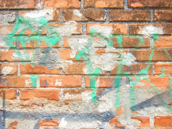 Obraz Brick wall with graffiti.