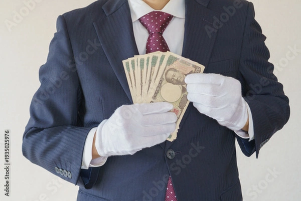 Obraz 白手袋をはめて現金を数えるスーツ姿の男性