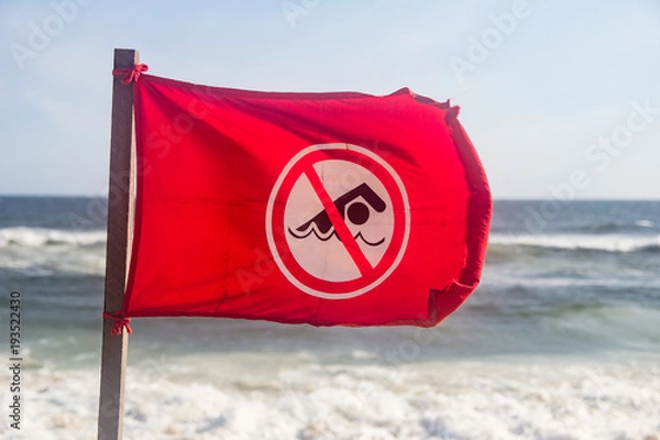 Obraz red flag at the beach