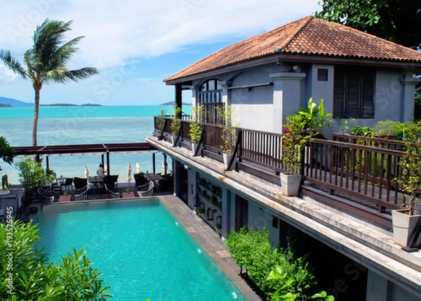 Fototapeta Cozy villa with the letter N in the center of a pool with a view of the stunning blue sea bay
