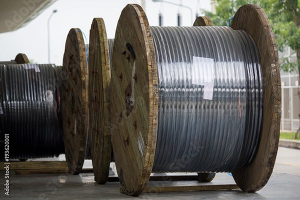 Fototapeta Rolls of high-voltage power cable on floor