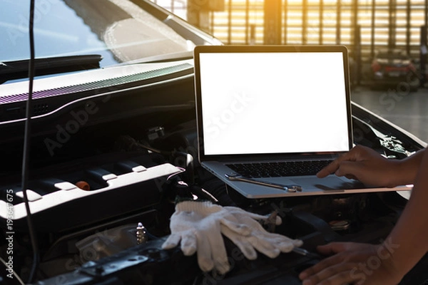 Fototapeta Mechanic repairing a car  in garage  Auto repair car engine, close u