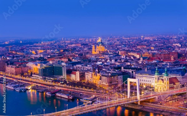 Fototapeta Beautiful night scene of the Budapest cityscape illuminated at twilight in Hungary.