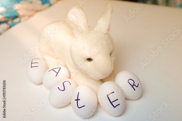 Fototapeta Eggs with the inscription of a Easter with rabbit (bunny)