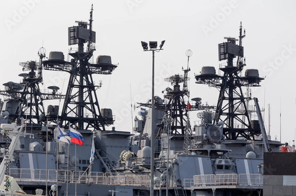 Fototapeta Superstructure of modern russian military cruiser battleship. Russian Navy Ensign and flags on the ship board. Russia, Vladivostok.