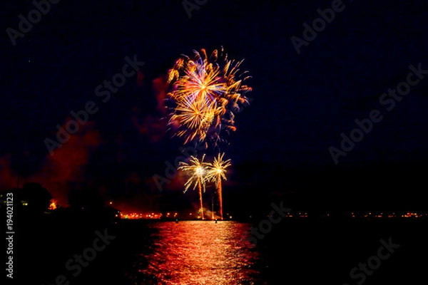 Obraz festive salute over the water of the river in summer